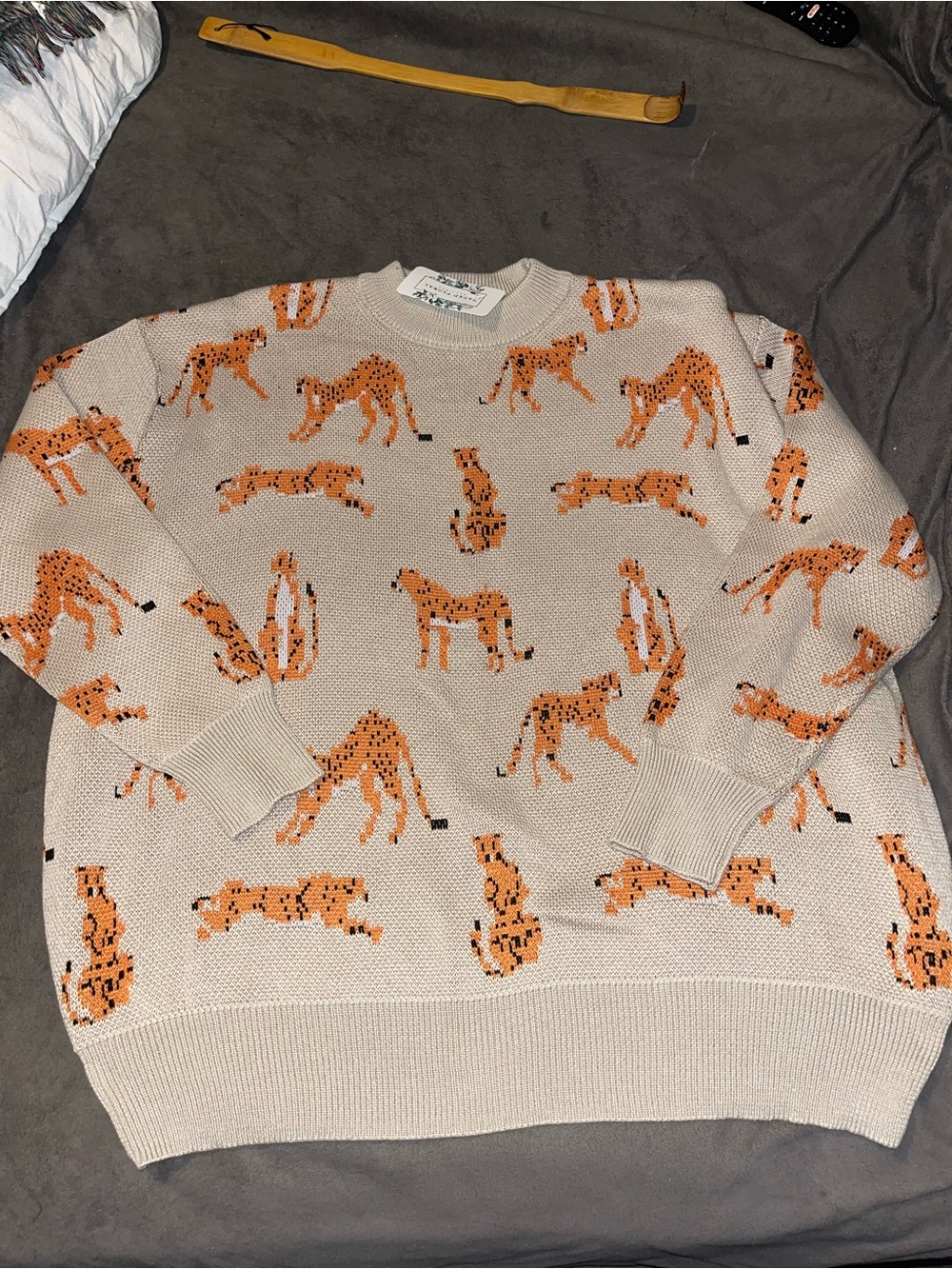Beige Crewneck Sweater with Orange Cheetah Knit Pattern